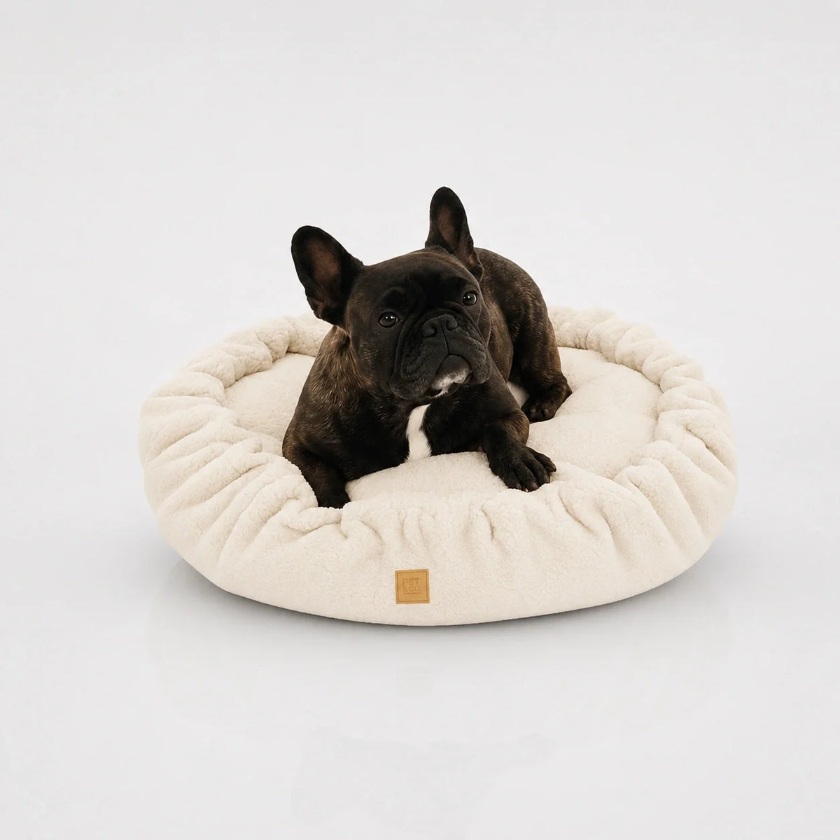 Weiches, rundes Hundebett mit Rüschen und kuscheliger Memory-Foam-Polsterung