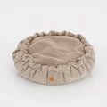 Weiches, rundes Hundebett mit Rüschen und kuscheliger Memory-Foam-Polsterung