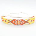 Yellow Geometric Beaded Bracelet with Orange and Copper Tone Accents